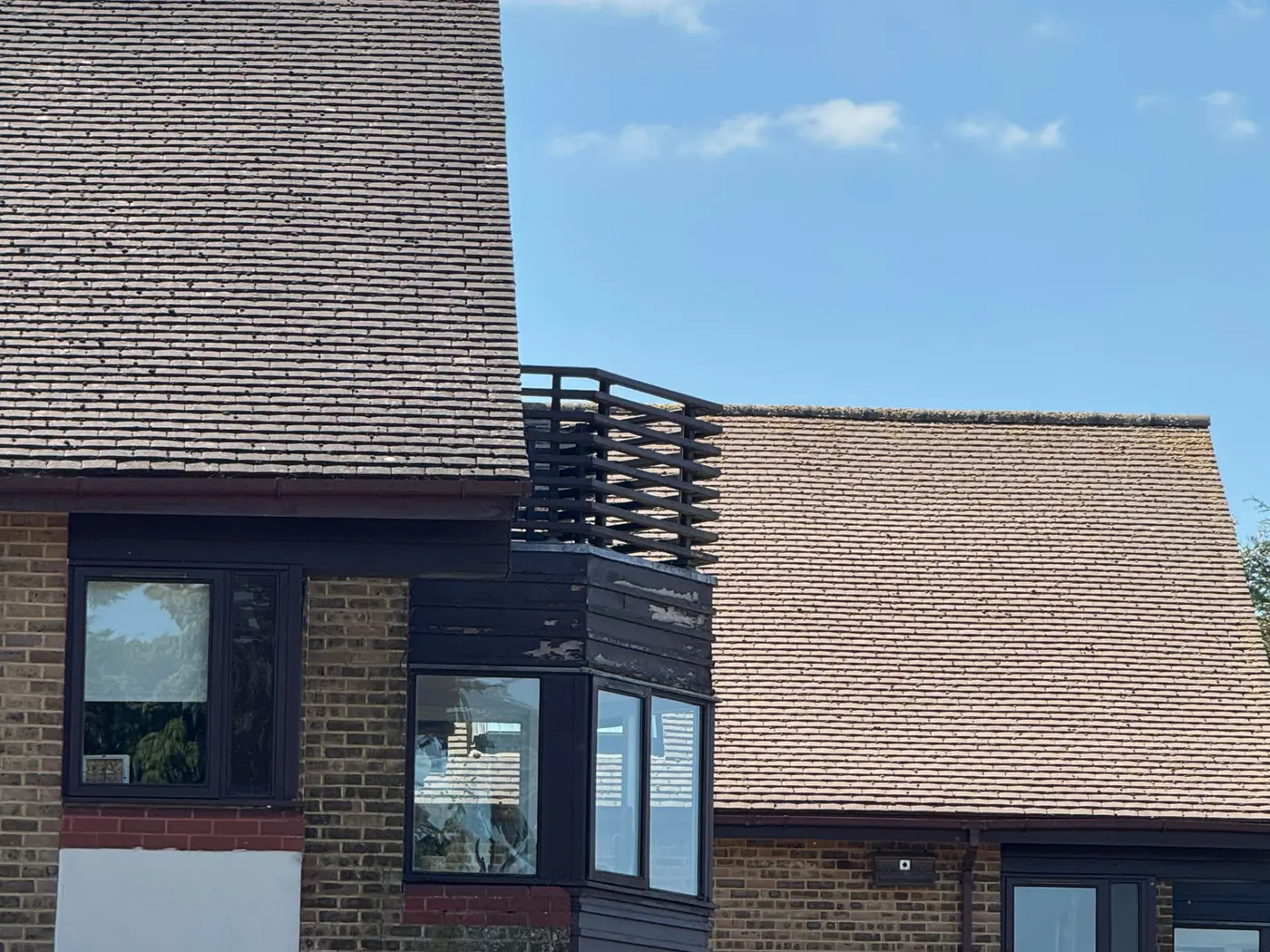 Tiled roof and rendered elevations of a house after exterior cleaning