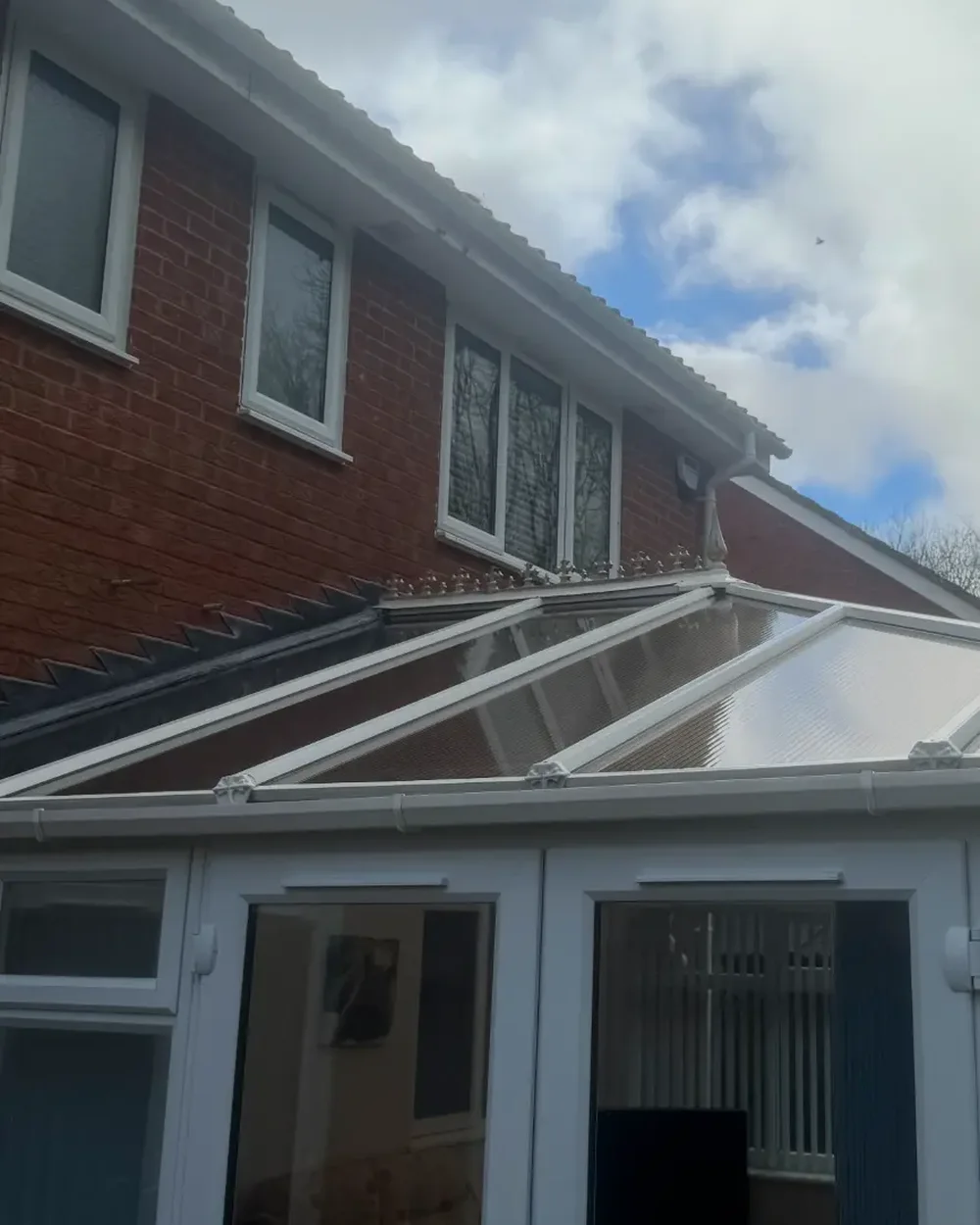 The same conservatory roof and frames cleaned back to a clear, bright finish