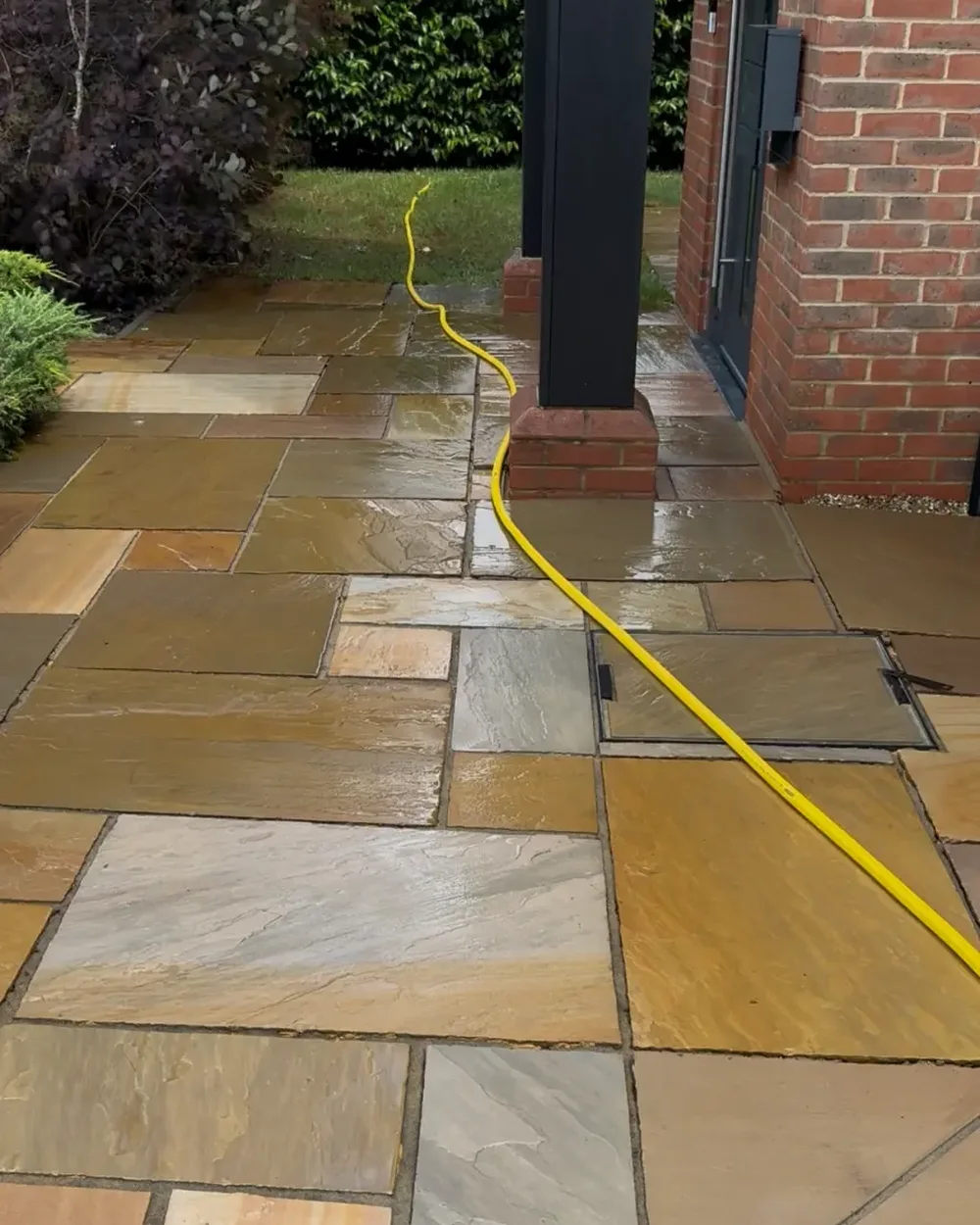 The same entrance path washed back to warm golden sandstone