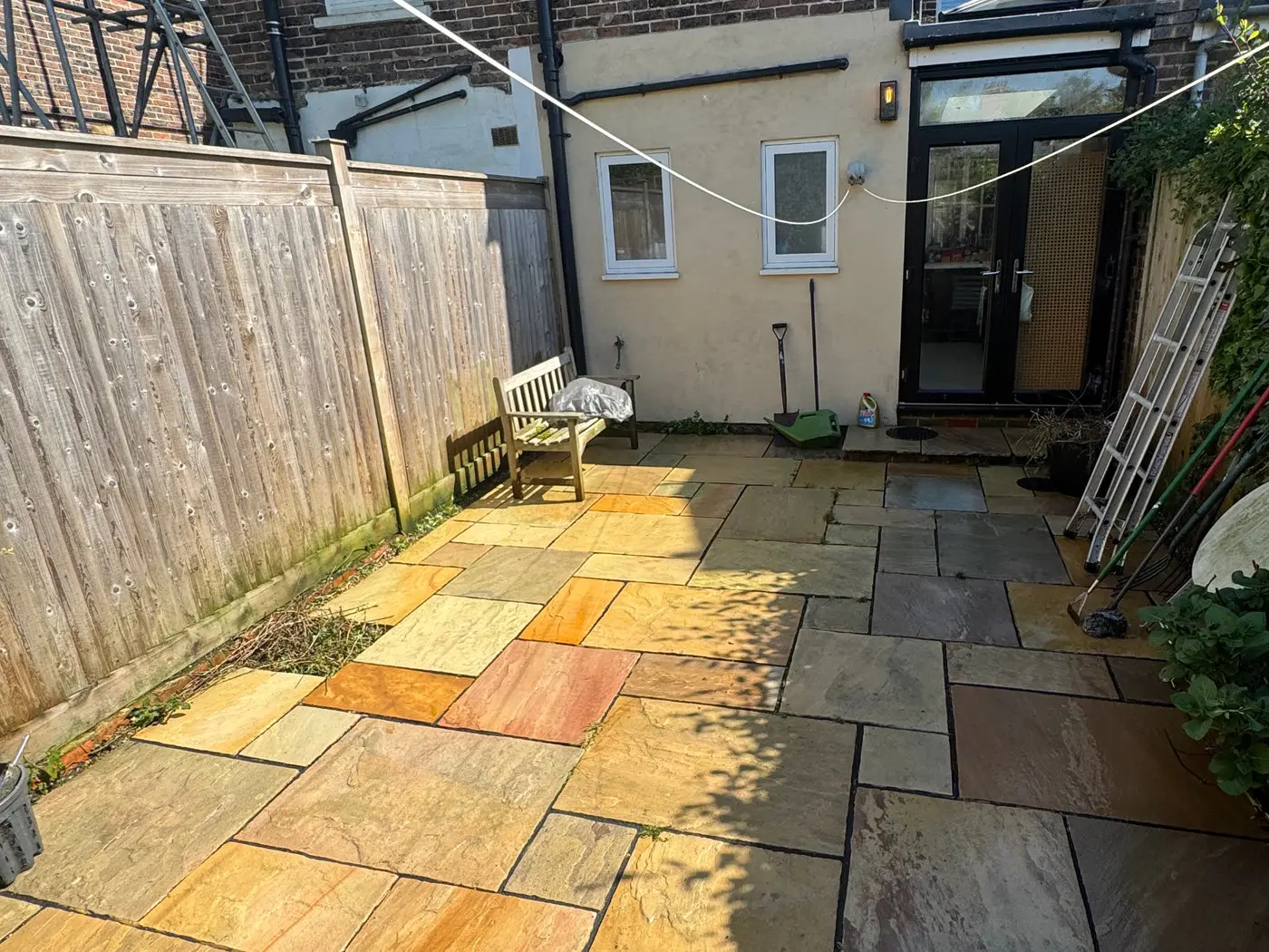 Indian sandstone patio and rear courtyard cleaned back to colour