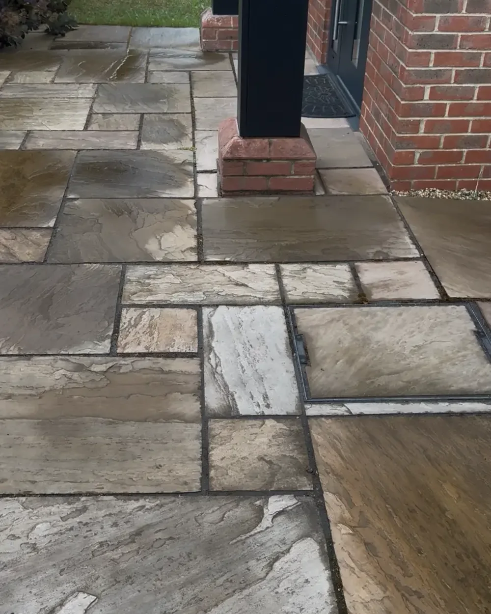 Indian sandstone entrance path and porch area dulled by dirt before cleaning