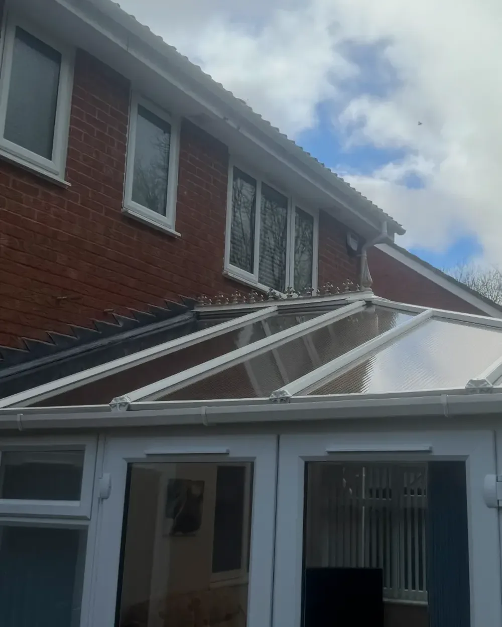 Cleaned conservatory roof panels and glazing bars after a low pressure clean